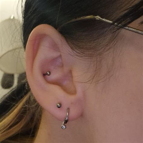 I had my upper lobe and conch pierced on my left ear (2nd image) today ...