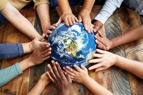 Premium Photo | Diverse Hands Reaching Towards Earth Globe for Global ...