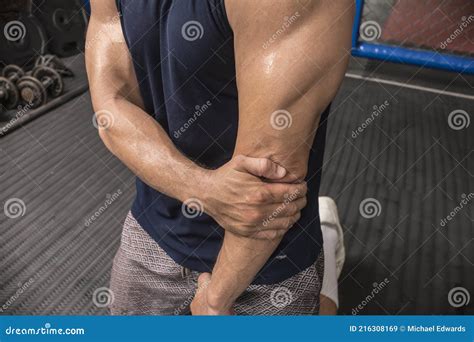 A Man Grabs His Elbow Due To Pain and Discomfort Caused by Elbow Joint Injury, Lateral ...