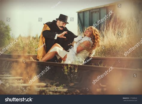 Damsel In Distress Woman Tied Up On Railway Line Stock Photo 117338542 ...