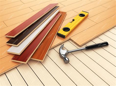 Premium Photo | Laying hardwood parquet concept hammer and level on the ...