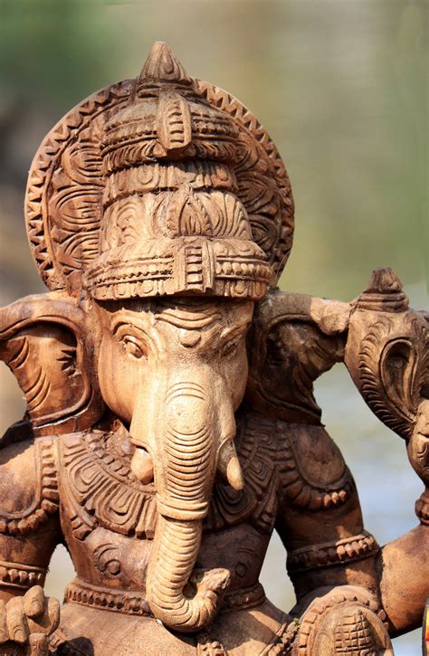 Download God Ganesh Wooden Statue Wallpaper | Wallpapers.com