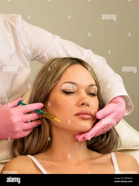 Esthetician uses thin needle to inject Platelet-Rich Plasma in skin ...