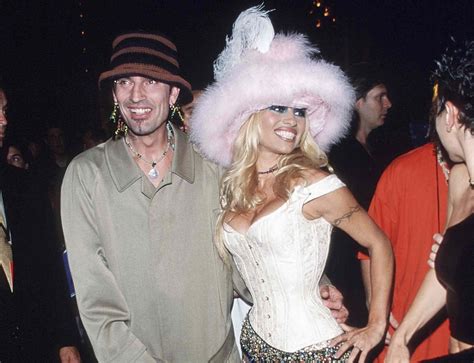 Pamela Anderson Channels Iconic 'Baywatch' Look in Red Tank Gown