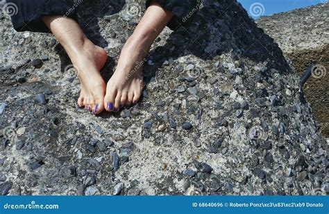 Teen girl feet on the rock stock photo. Image of girl - 68640696