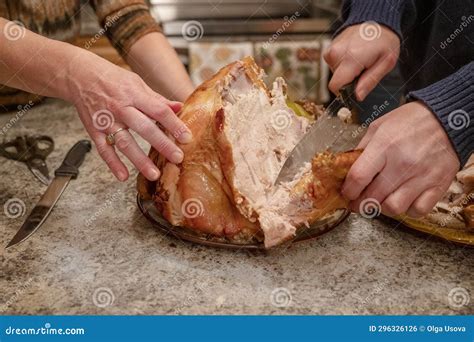 Family Preparing Turkey for Thanksgiving Dinner. Person Cutting Big ...