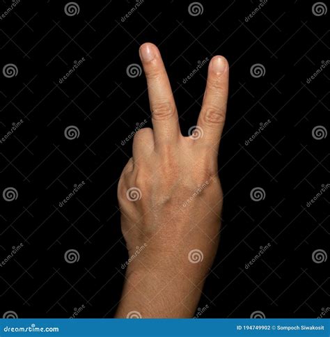The Man`s Hand that Holds Two Fingers is a V Sign, Meaning Victory. or Still Means Peace and ...