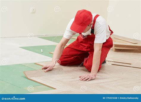 Worker Laying Laminate Floor Covering at Home Renovation Stock Photo ...