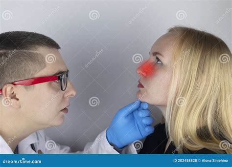 A Young Woman Touches Her Nose, Which is Very Painful. Medical Care Concept for Difficulty ...