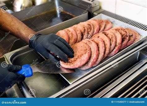 Chef Taking a Pre-cooked Hamburger Patty Stock Image - Image of food ...
