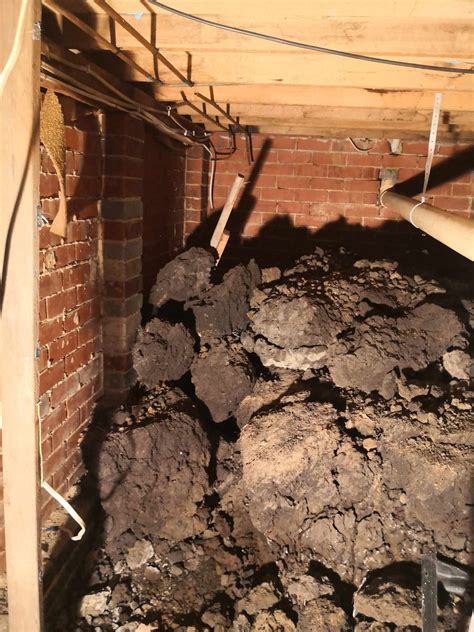 Best safest way to clear dirt from under house that is pushing against ...