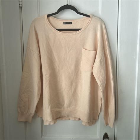 Cream colored sweater with ribbed pocket detail.... - Depop