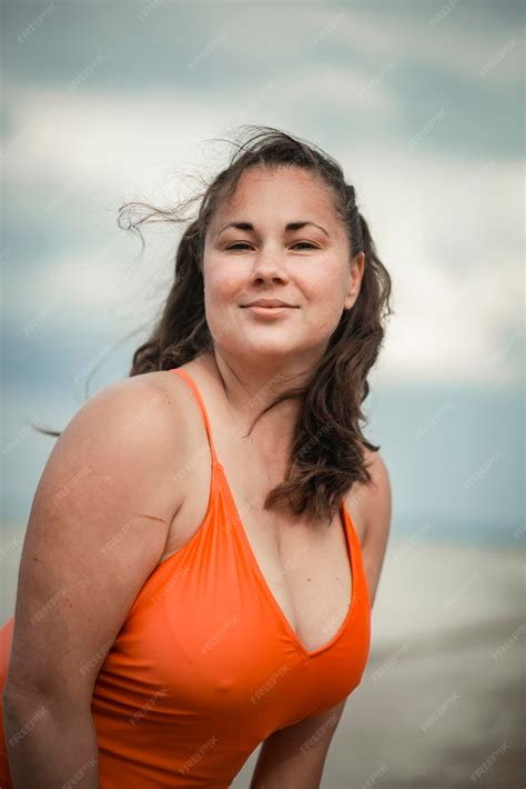 Premium Photo | Beautiful woman 40 years old plus size, on the beach in ...