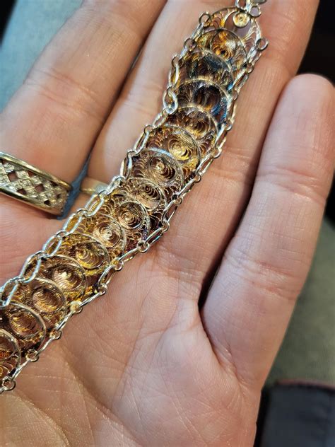 What causes this type of tarnish on silver? : r/jewelry