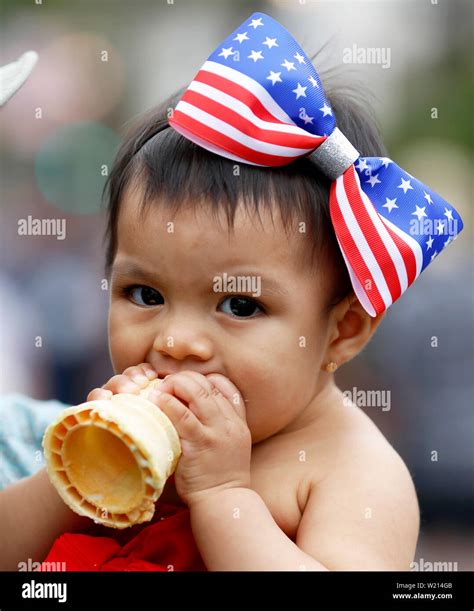 Santa Barbara, USA. 4th July, 2019. A baby watches the parade to ...