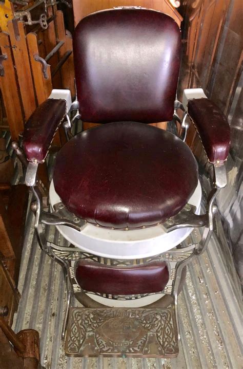 ANTIQUE BARBERS CHAIR W / FOOT & HEAD REST