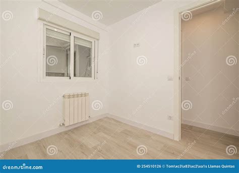 Empty Room with Light Wood Flooring, Plain White Paint Walls and ...