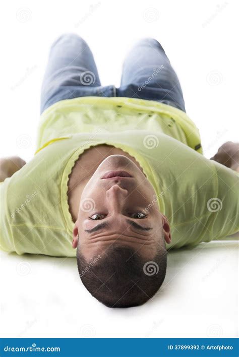 Handsome Young Man Laying on the Floor, Belly Up Stock Photo - Image of ...