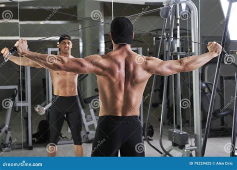Handsome Powerful Athletic Man Doing Cable Crossover Exercise. Stock ...