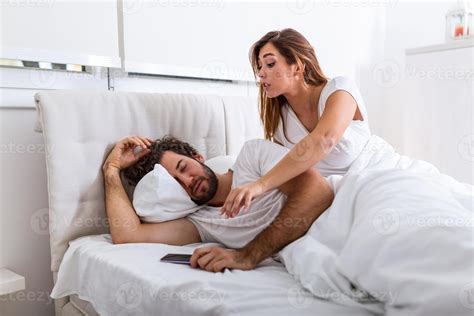 Wife secretly watches the husband's phone while the husband sleep. The ...