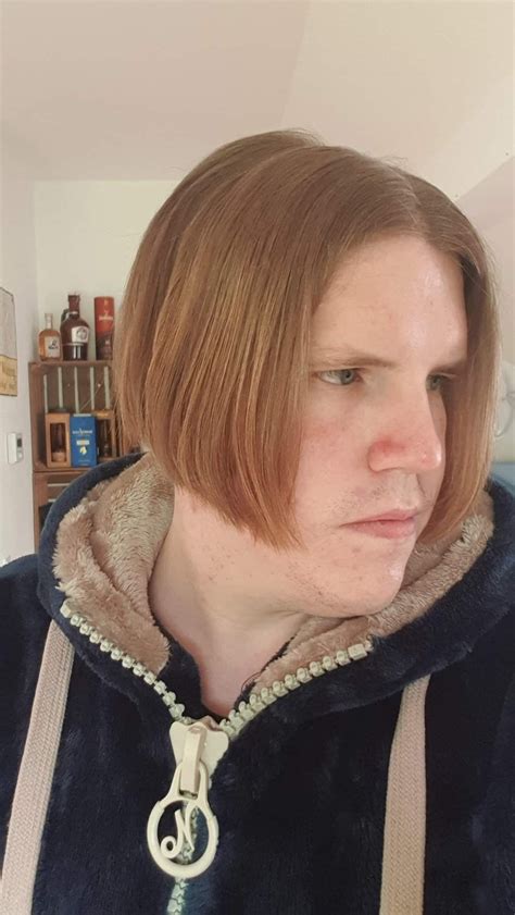 Beautiful guy with a feminine men bob haircut and fluffy teddy bear ...