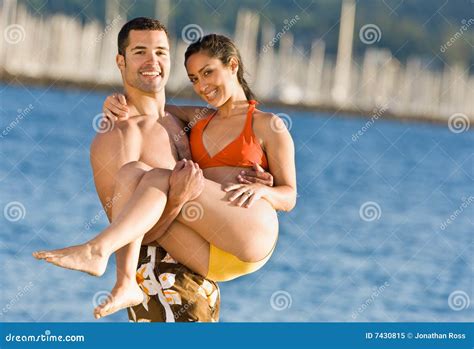 Boyfriend Carrying Girlfriend at Beach Stock Image - Image of person ...