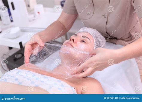 Anesthesia on Skin of Face. Applying an Anesthetic in Form of Cream on ...