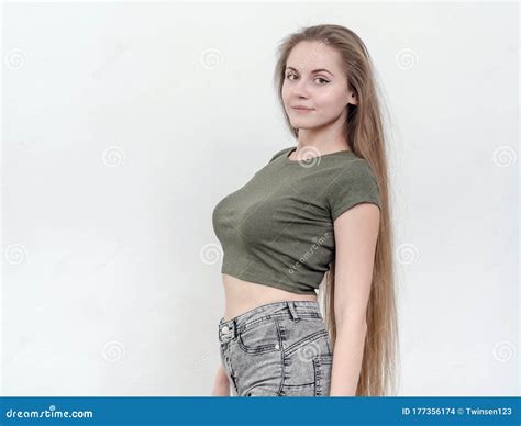 Nice Girl with Beautiful Breasts in a Green T-shirt Posing on Ca Stock ...