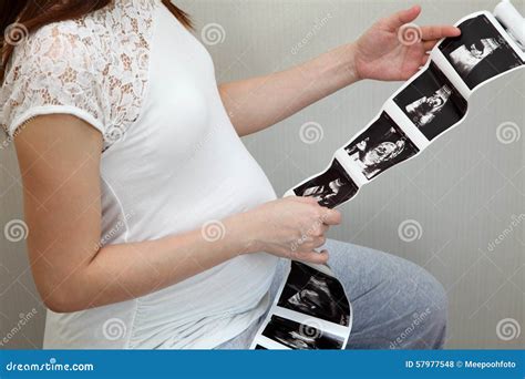 Pregnant Woman Holding Ultrasound Scan Photo Stock Photo - Image of ...