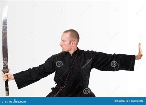 Martial Arts Teacher with Sword Up Stock Photo - Image of guard, habit ...