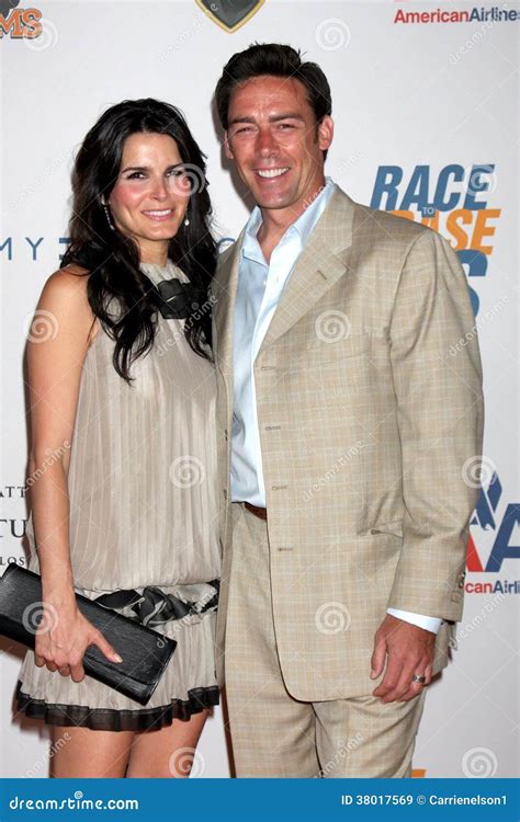 Angie Harmon,Jason Sehorn editorial stock image. Image of erase - 38017569