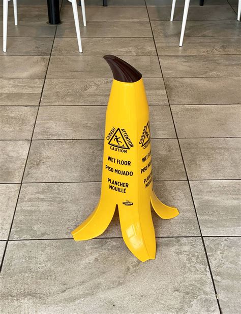 This wet floor sign shaped like a banana peel. : mildlyinteresting