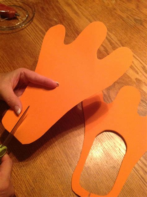 Cut out a webbed foot shape out of craft foam. Cut out the middle to go ...