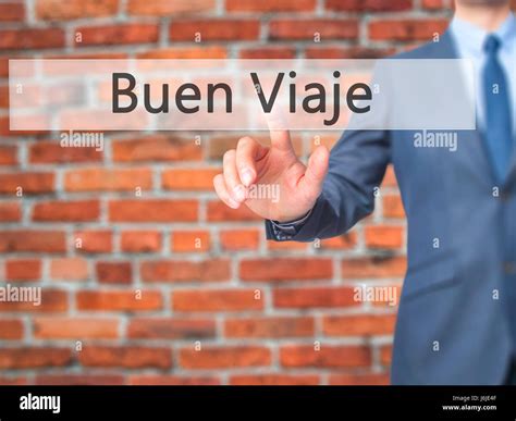 Buen Viaje (Good Trip in Spanish) - Businessman hand touch button on ...