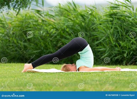 Woman Practicing Yoga Halasana Plow Pose Stock Photo - Image of ...