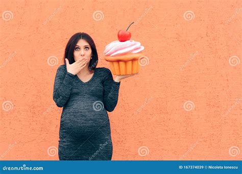 Pregnant Woman Craving Sweets Holding Huge Cupcake Stock Image - Image ...