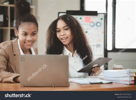 Two American Women Working Together Office Stock Photo 2230770251 ...