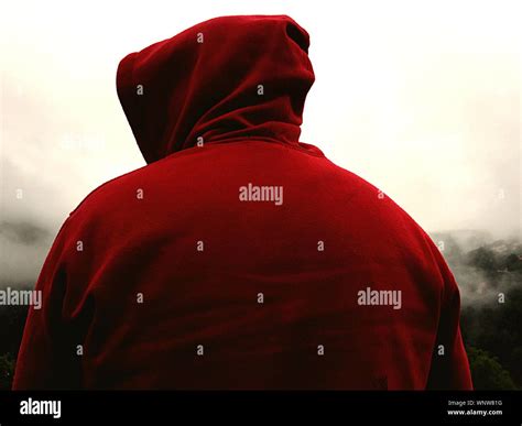 Man wearing red hooded shirt hi-res stock photography and images - Alamy