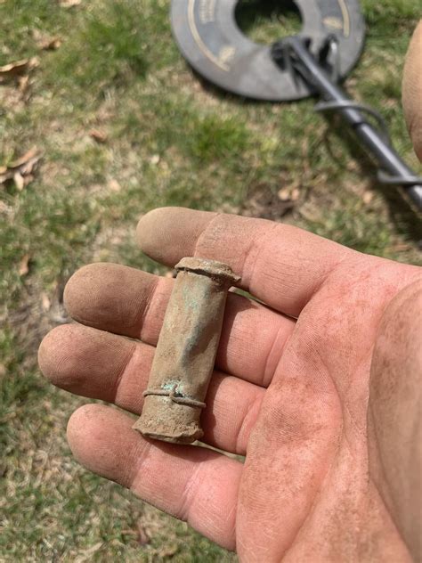 Found this little copper capsule. Before I open it - Anyone have any idea what could be in it ...