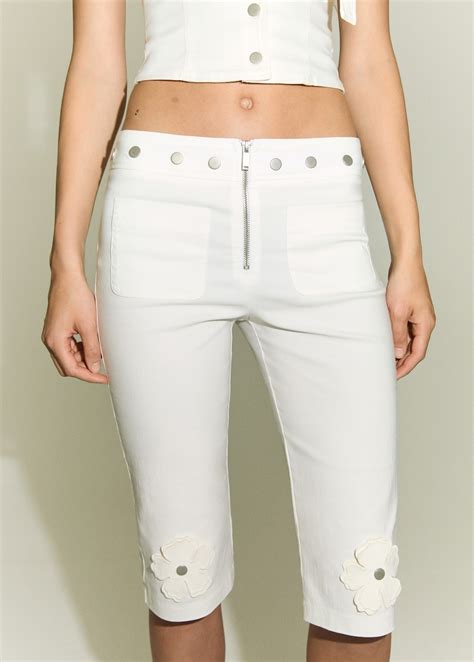 Capri trousers with decorative buttons - Women | MANGO United Arab Emirates