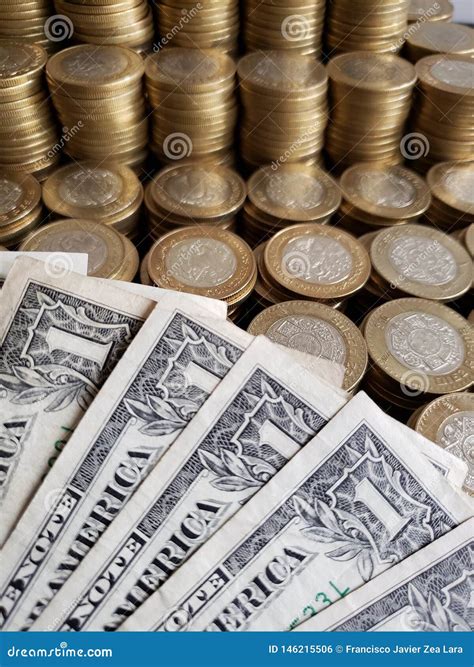 Approach To American Dollars Bills and Mexican Coins of Ten Pesos Stock ...