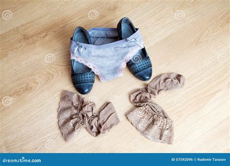 Women's Shoes, Panties And Stockings Lying On The Floor Stock Photo ...