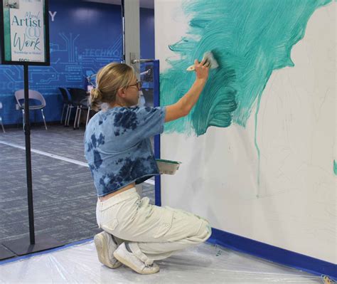 Fifth-year FGCU student Macy Noll installing 'Knowledge in Motion ...