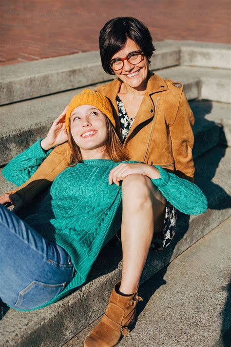 "Mother And Her Daughter On The Street In A Sunny Autumn Day." by ...
