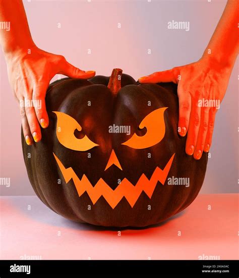 Halloween Pumpkin with Paper Cut Scary Face on a White Background. Jack ...