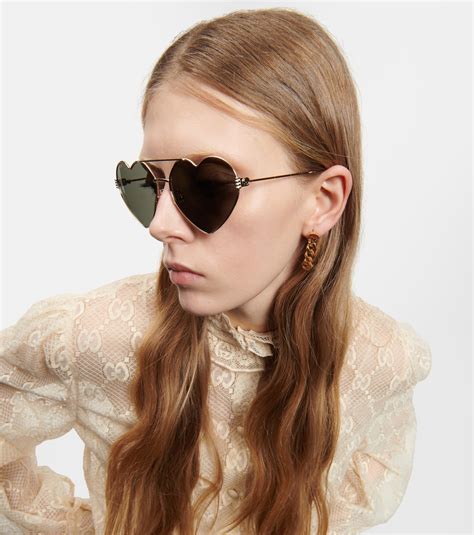 Heart-shaped sunglasses in gold - Gucci | Mytheresa