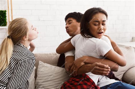 Premium Photo | Girlfriend discovering her boyfriend cheating with her ...