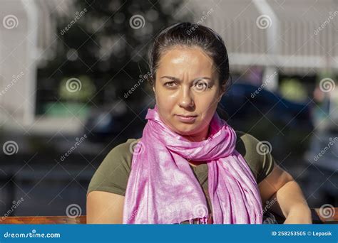 Portrait of a 35-40 Year Old Woman with a Pink Scarf Around Her Neck ...