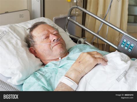 Sick Person In Hospital Bed