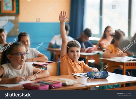 Elementary Students Raising Their Hands